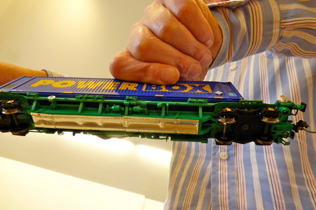 Aluminium Foil Tape on the bottom of a model train carriage - underneath